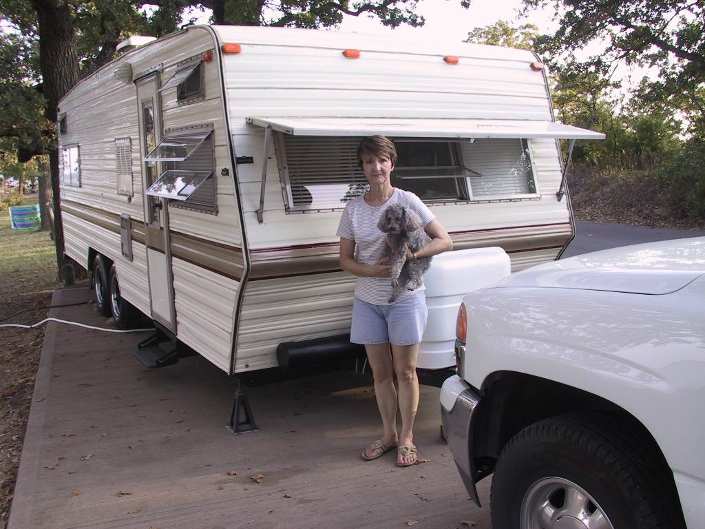 Jeanne standing by trailer